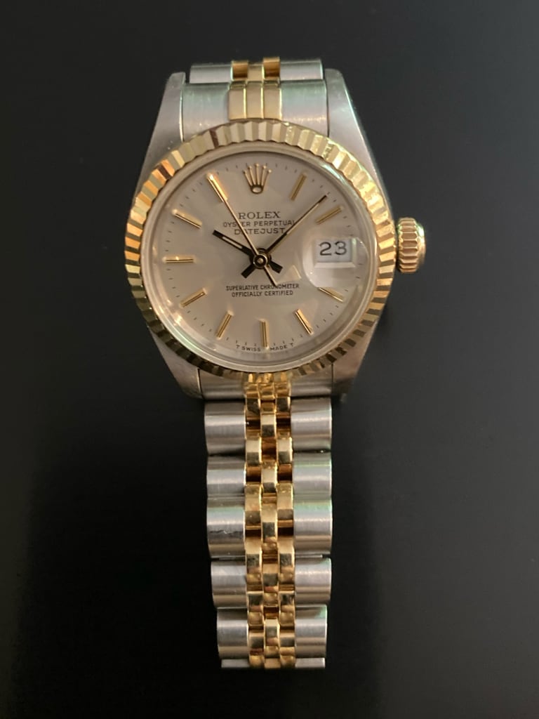Rolex Lady Datejust 69173 silver dial, 18kt gold baton indices and hands, angled front view