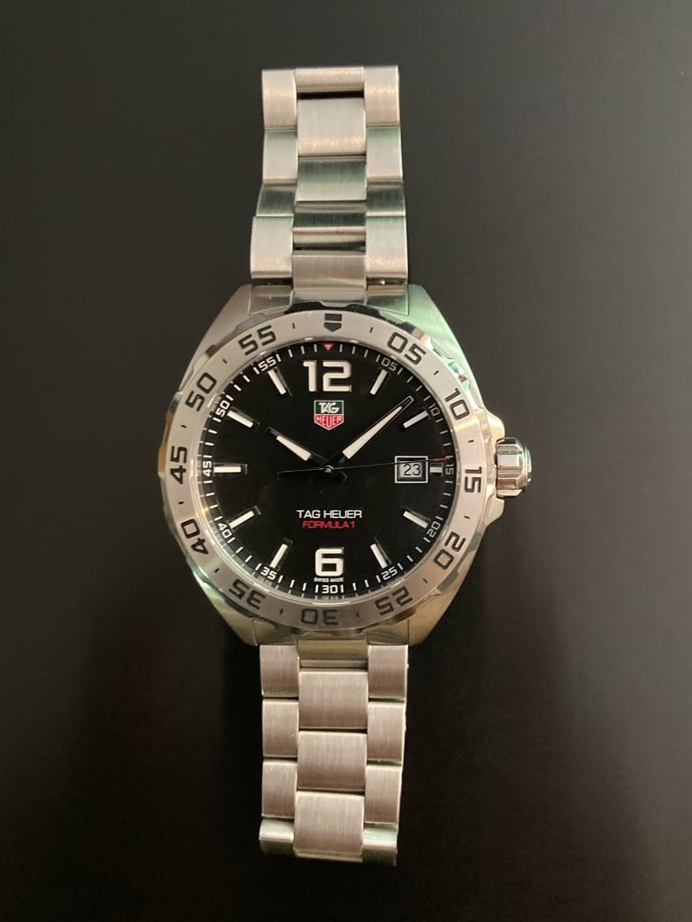 Pre-owned TAG Heuer Formula 1 Date WAZ1112.BA0875 black dial with luminous hands and polished steel bracelet