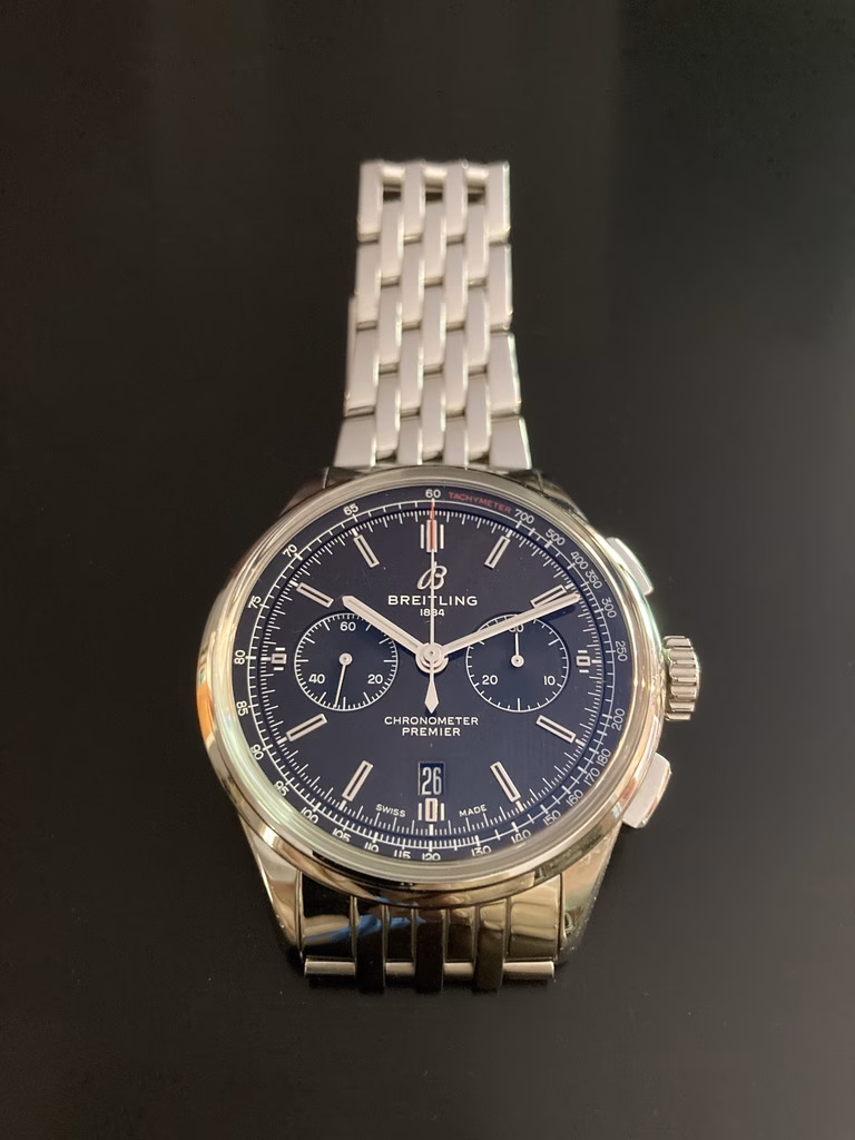 Breitling Premier B01 Chronograph 42 Bentley dial photographed indoors, where the British Racing Green reads almost black